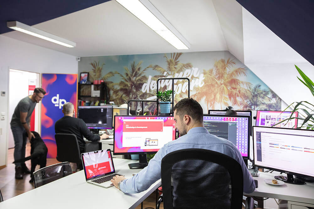 Client in Rugby reviewing SEO performance report with idWebsites team